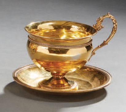 null Breakfast cup and saucer in vermeil, the body of the cup and the saucer decorated...