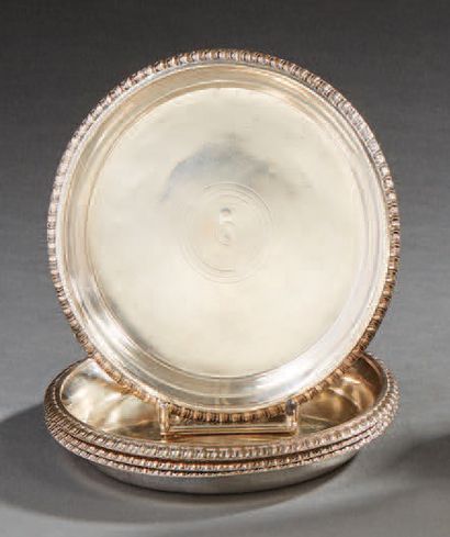 null Suite of four silver coasters, the border decorated with large gadroons.
Diameter:...