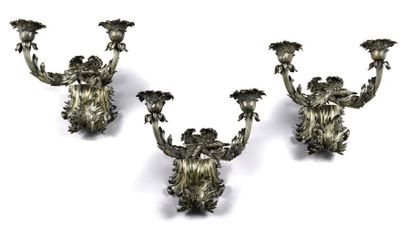 null Suite of three finely chiselled vermeil sconces. The arms of lights with foliated...