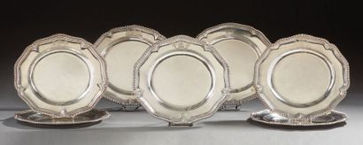 null A set of seven plates Argent, the rims set with large gadroons, the wings engraved...