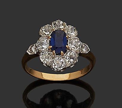 null MARGUERITE RING in 18K (750) et platine yellow gold set with a sapphire in a...