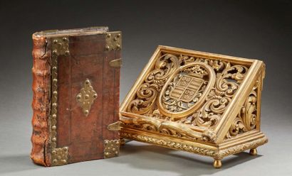 null Gilded and armoured openwork wooden BOOK RACK. A leather-bound bible with metal...