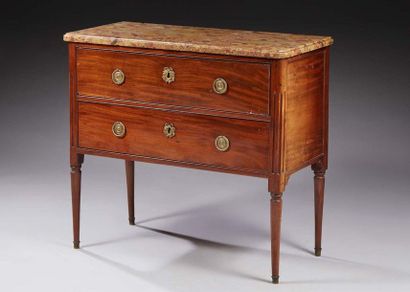 null Small mahogany COMMODE opening by two drawers, the rounded fluted uprights extended...