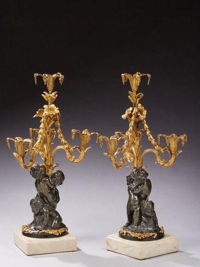 null RARE PAIR OF Candelabra with four lights in finely chiselled bronze, patinated...