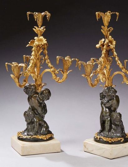 null RARE PAIR OF Candelabra with four lights in finely chiselled bronze, patinated...