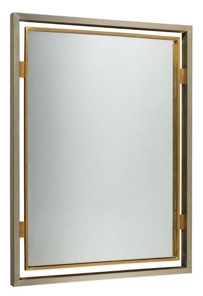 GUY LEFEVRE (XXème) 
Miroir rectangulaire et métal chromé et laiton 
Dim. : 84 x...