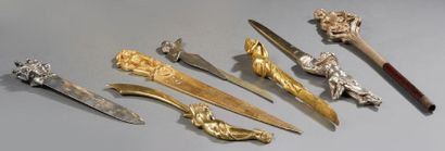 TRAVAIL FRANÇAIS 
Set of six paper cutters and an umbrella pommel in gilt bronze,...