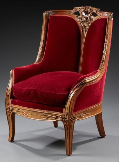 Louis MAJORELLE (1859-1926) 
Armchair model "Pommes de Pins" in carved walnut 
Upholstery...