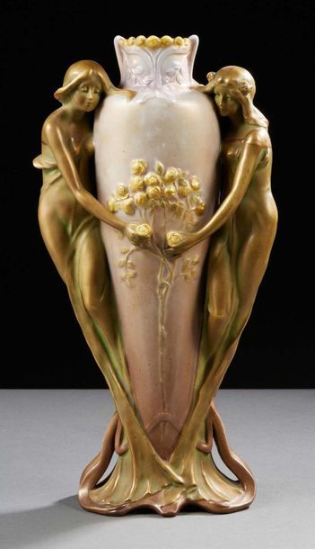 AMPHORA 
Glazed ceramic vase with relief decoration of women and flowers 
Signed...