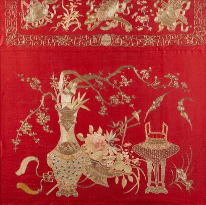 CHINE vers 1900 
Part of a red silk panel, embroidered with gold threads and polychromes...