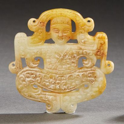 CHINE XXe siècle Ornament in nephrite celadon and rust, acrobat decorated with volutes.
H.:...