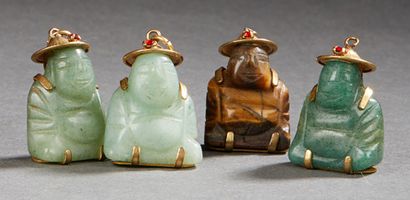 CHINE XXe siècle Four small pendants in jadeite and budai tiger's eye sitting.
H.:...