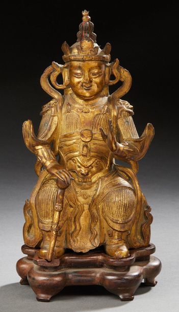 CHINE FIN ÉPOQUE MING (1368 1644) 
Statuette de gardien en bronze doré
Socle en bois...