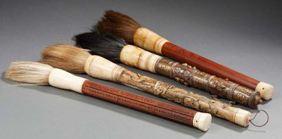 CHINE ET TIBET XXe SIÈCLE Four large brushes, bamboo handles decorated with dragons...