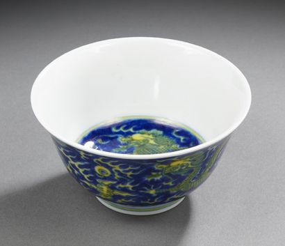 CHINE Circular porcelain bowl decorated in blue underglaze and yellow with two pentadactyl...