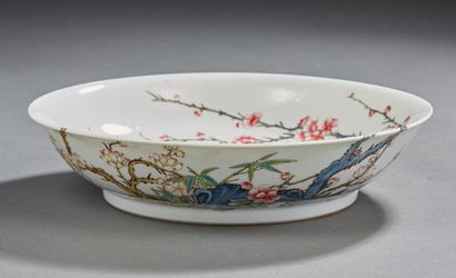 CHINE Circular porcelain bowl with white background decorated in rose family enamels...