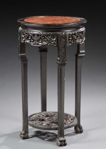 INDOCHINE Pedestal table in carved openwork wood with a circular red marble top,...