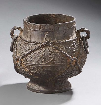 CHINE Bronze vase with a brown patina in archaic style, baluster-shaped, with two...
