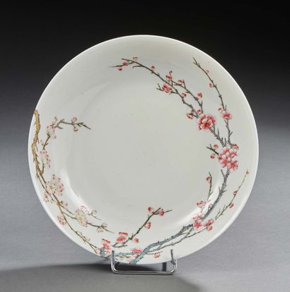 CHINE Circular porcelain bowl with white background decorated in rose family enamels...