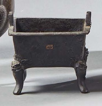 CHINE Small rectangular bronze incense burner with brown patina on four legs with...