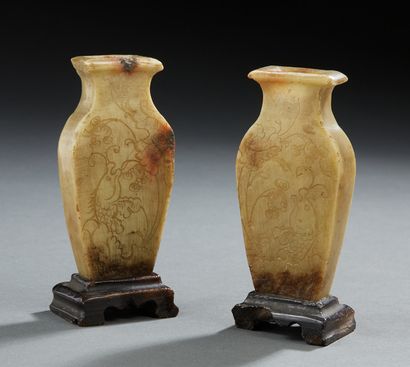 CHINE Two small carved soapstone altar vases in baluster form resting on pedestals,...