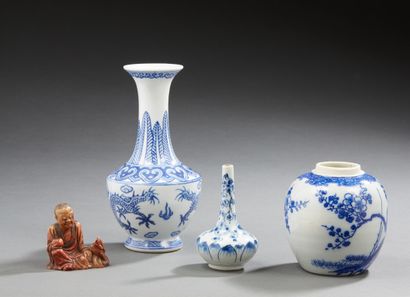 CHINE White porcelain set with blue motifs including a pot without cover, a long-necked...