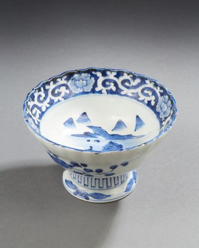 CHINE Porcelain bowl on foot decorated in blue underglaze with scrolls and mountainous...