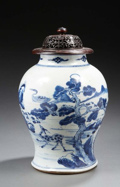 CHINE A baluster-shaped porcelain vase decorated in blue underglaze with two deer...