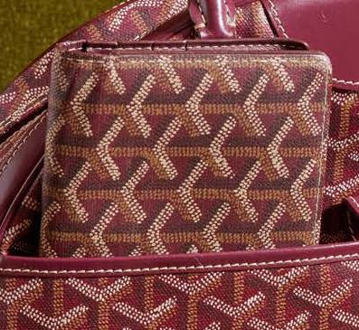 GOYARD Paris Portefeuille en toile enduite et veau bordeaux
Doublure intérieure en...