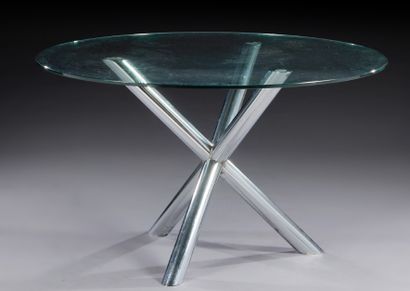 TRAVAIL 1970 
Table de salle à manger, plateau en verre circulaire reposant sur un...