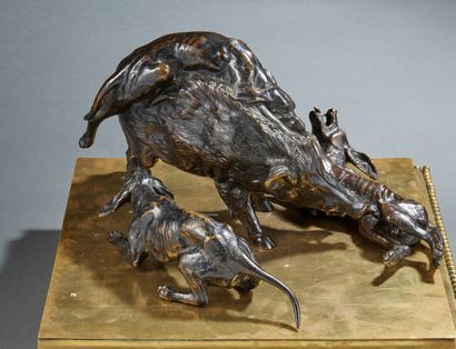null A chased and patinated bronze GROUP representing a boar hunt in the form of...