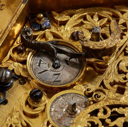 null RARE table clock in bronze or engraved brass, gilt or silvered; the dial with...