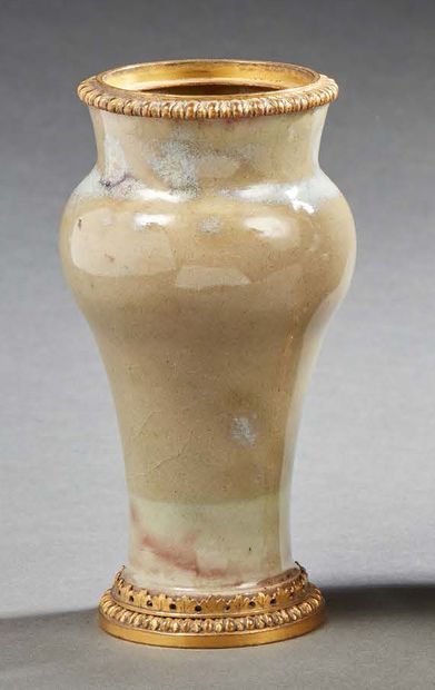 null SMALL VASE in glazed ceramic with gilded and chased copper mounting; the neck...
