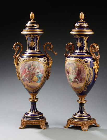 null A PAIR OF LARGE blue porcelain VASES in the Sèvres style; the necks with gold...
