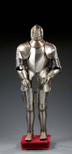 null FANTAISIE ARMOUR in wrought iron; the helmet with pierced visor; the gauntlets...