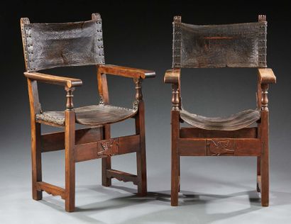 null Pair of walnut armchairs turned or carved with embossed leather backs and seats;...
