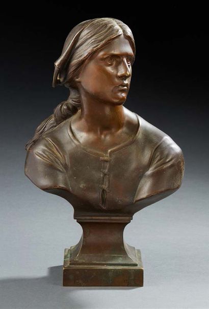 null A bronze bust with a medallic patina representing Joan of Arc, her head turned...