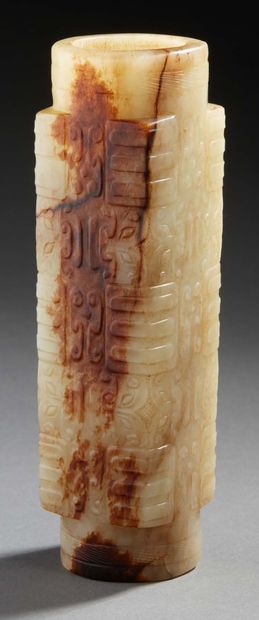 CHINE 
Jade cylinder carved in light green with traces of rust with archaic style...