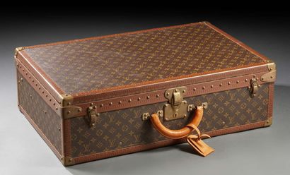 LOUIS VUITTON 
Bisten suitcase, Monogram canvas and Monogram lozine, gilt metal studs...