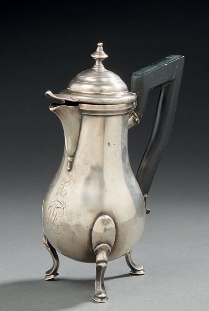 null A SMALL silver tripod jar with a blackened wooden handle.
Eastern European work...