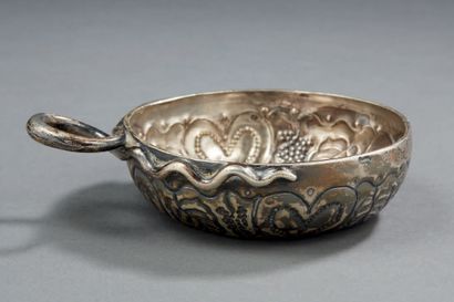 null Silver TASTEVIN, the handle serpentiform, with embossed decorations of leaves,...