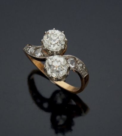 null 
YOU & ME RING in yellow gold 750 mm and platinum set with two old cut diamonds...