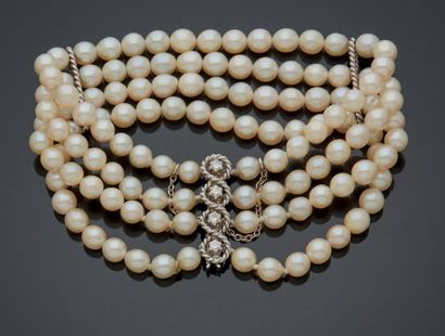 null BRACELET composed of four rows of cultured pearls sporadically interspersed...