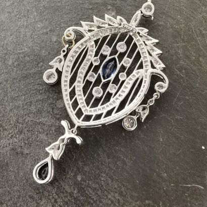 null 
A gold openwork fruit of the Indies pendant, centered on a small navette-cut...