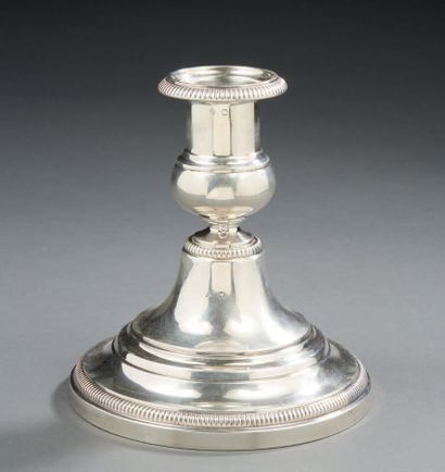 HENIN et Cie A silver toilet candlestick, the base decorated with a frieze of gadroons,...