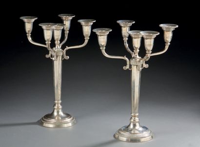 null A PAIR OF FIVE LIGHT FLAMPS in silver, the base decorated with a frieze of heart...