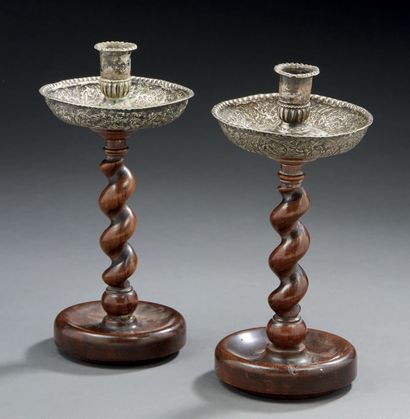 null PAIR OF CANDLES in silver finely chased resting on a foot and a base in turned...