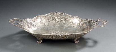 null A silver FRUIT BOWL with handles decorated with putti, foliage and flowers.
Foreign...