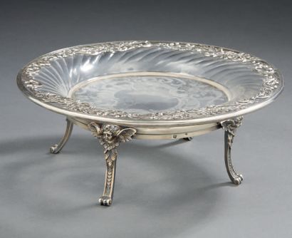 null MIGNARDISES PRESENTER in engraved crystal and silver.
It rests on three scrolled...