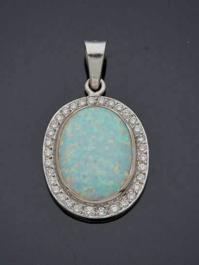 null A white gold pendant with an oval cabochon opal set with brilliant-cut diamonds....